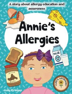 A cover of a children's book called 'Annie's Allergies' featuring a little girl surrounded by different types of food